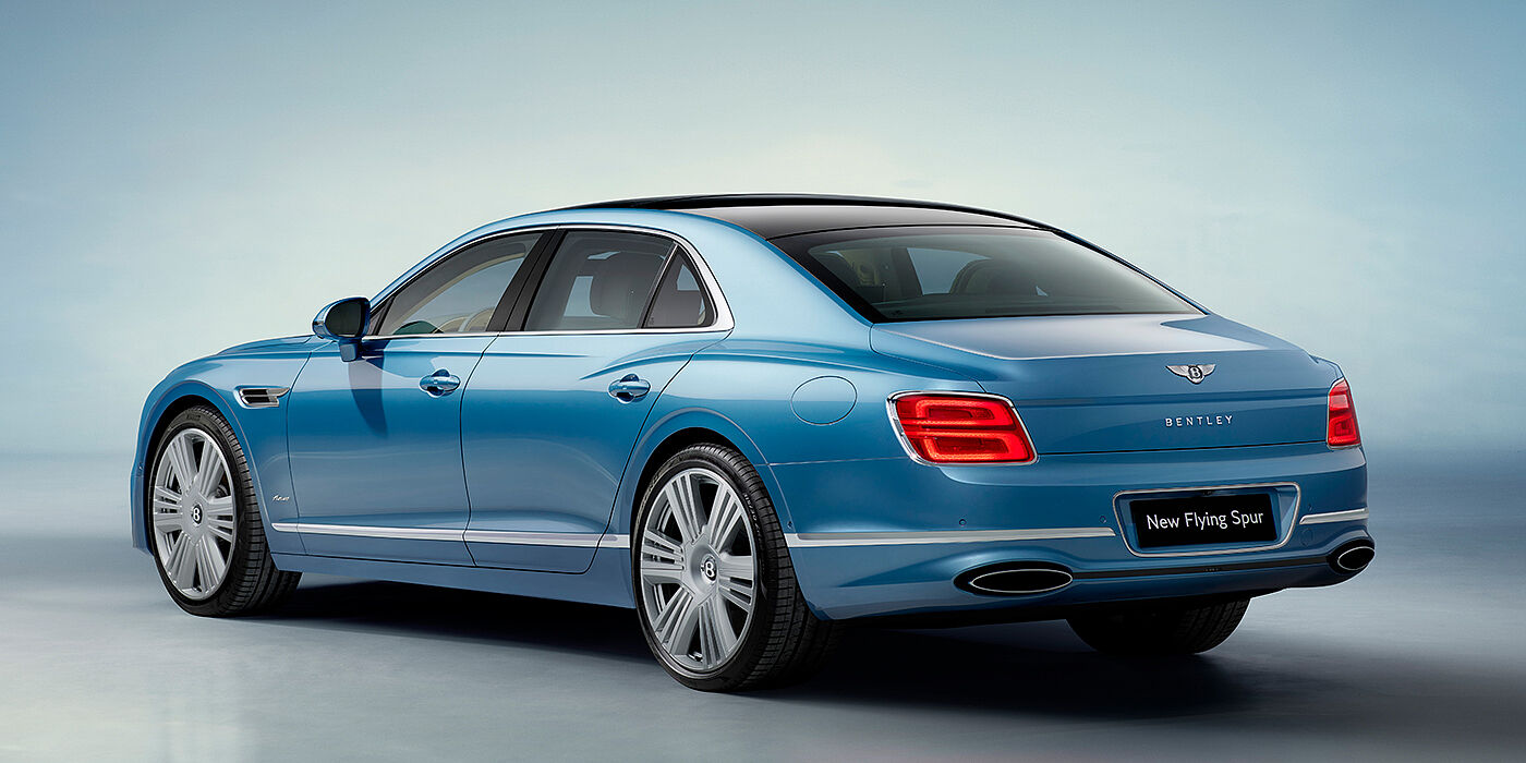 Bentley Tallinn New Bentley Flying Spur Azure sedan rear view in Light windsor blue by Mulliner paint with 22 inch Azure wheels and chrome exterior details
