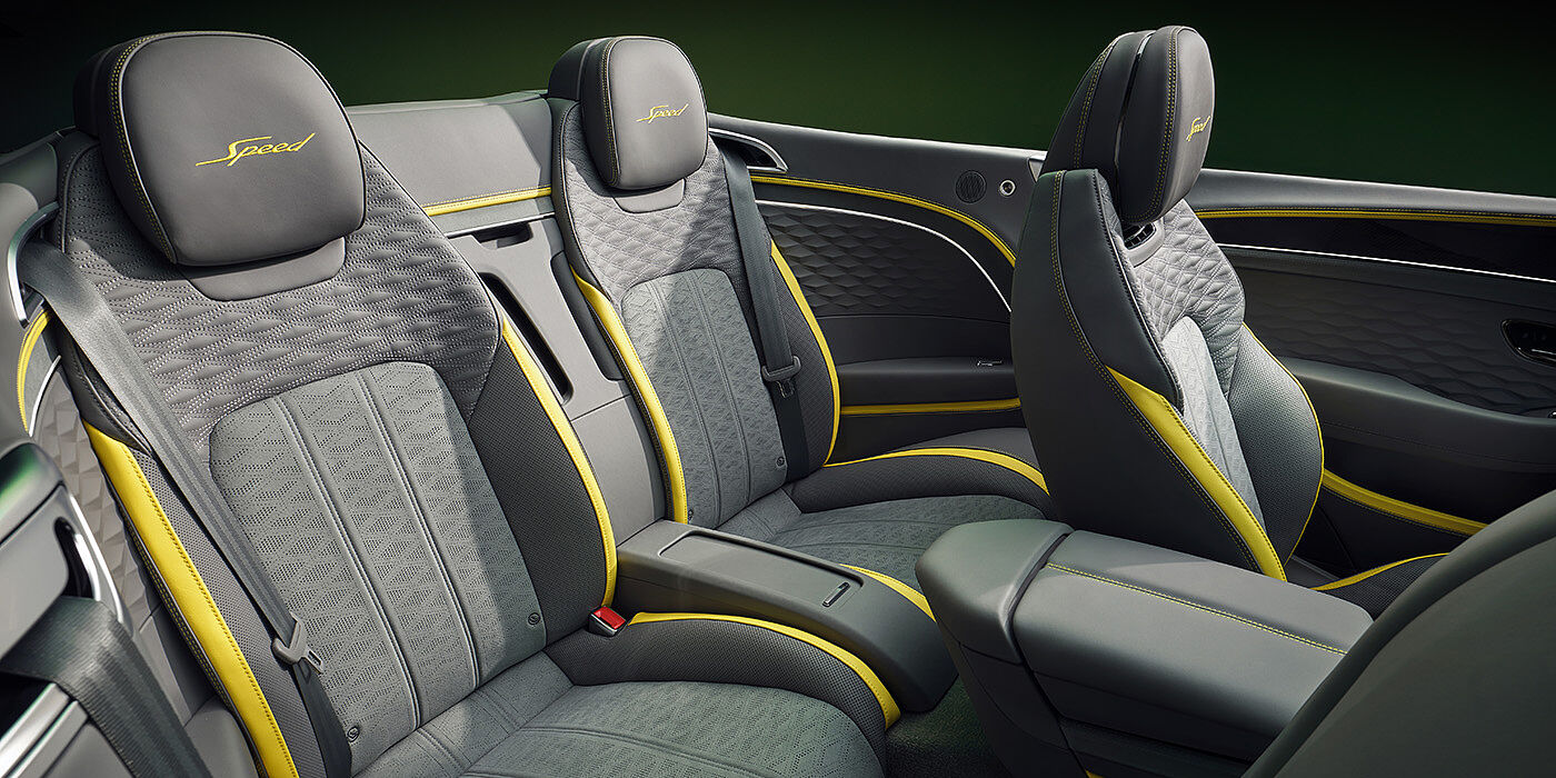 Bentley Tallinn Bentley New Continental GTC Speed convertible rear interior with unique Speed colour split in Gravity Grey and Cyber Yellow hide colours, and contrast stitched headrest emblems 