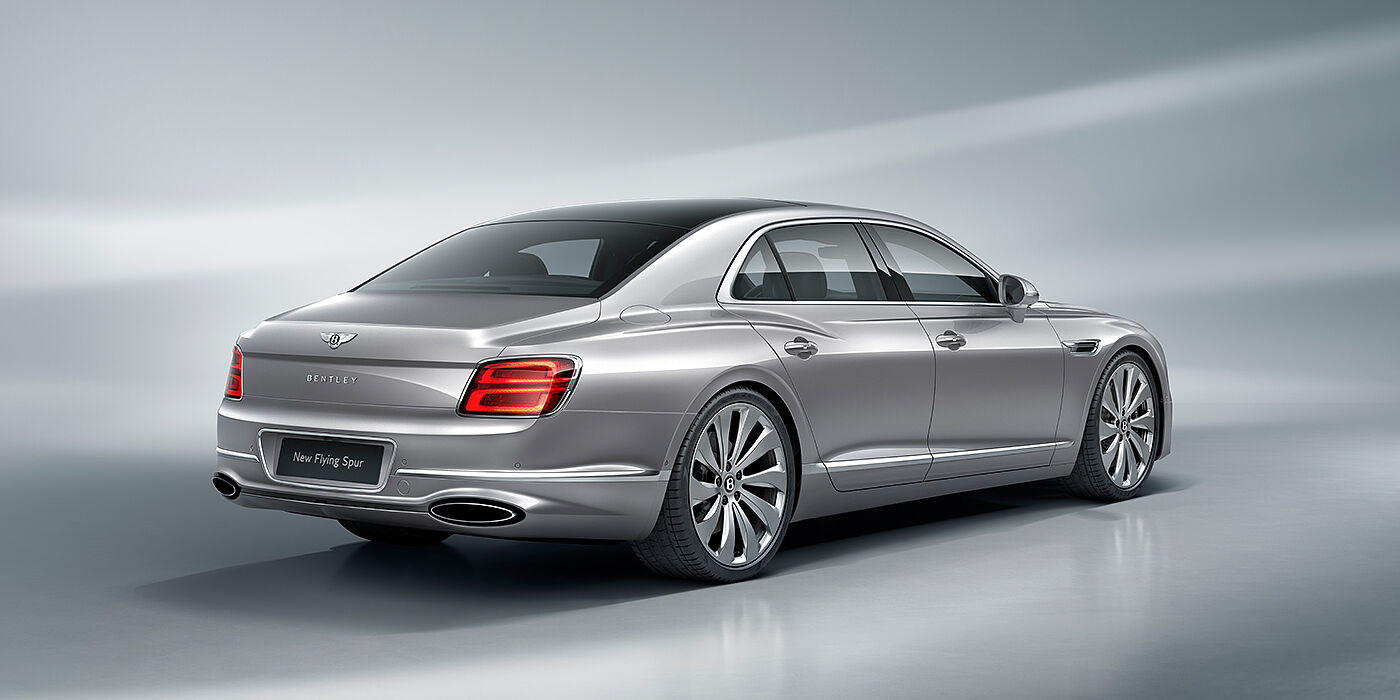 Bentley Tallinn New Bentley Flying Spur sedan rear view in Silverlake paint with ten spoke wheels and chrome matrix grille