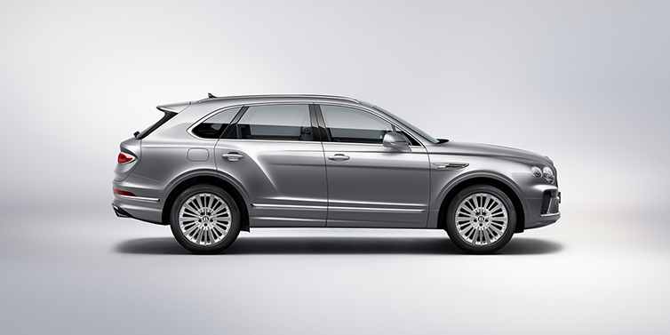 Bentley Tallinn Bentley Bentayga SUV side profile in Moonbeam silver paint against white background featuring 21 inch 5 spoke wheels