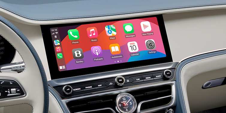 Bentley Tallinn New Bentley Flying Spur Azure sedan front cabin central MMI screen showing available services against Linen and Brunel hides and Piano Linen veneer