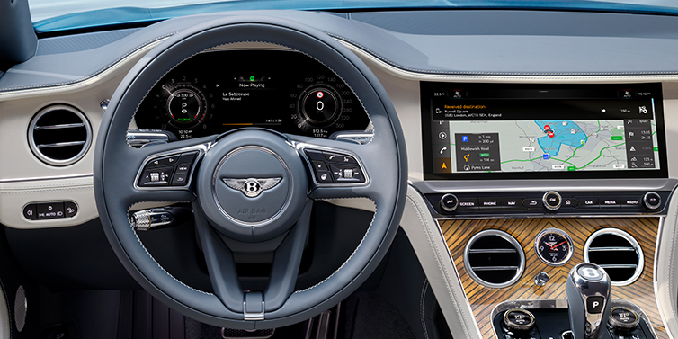 Bentley Tallinn New Bentley Continental GT Azure coupe front interior in Linen and Brunel blue hides, showing steering wheel and driver's instruments